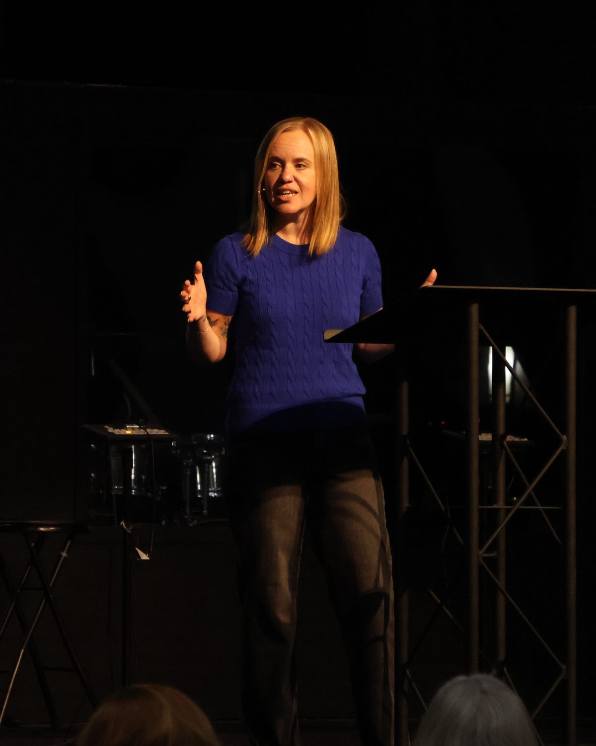 Shanna Dinsmore teaching from the stage at a Ladies Night event